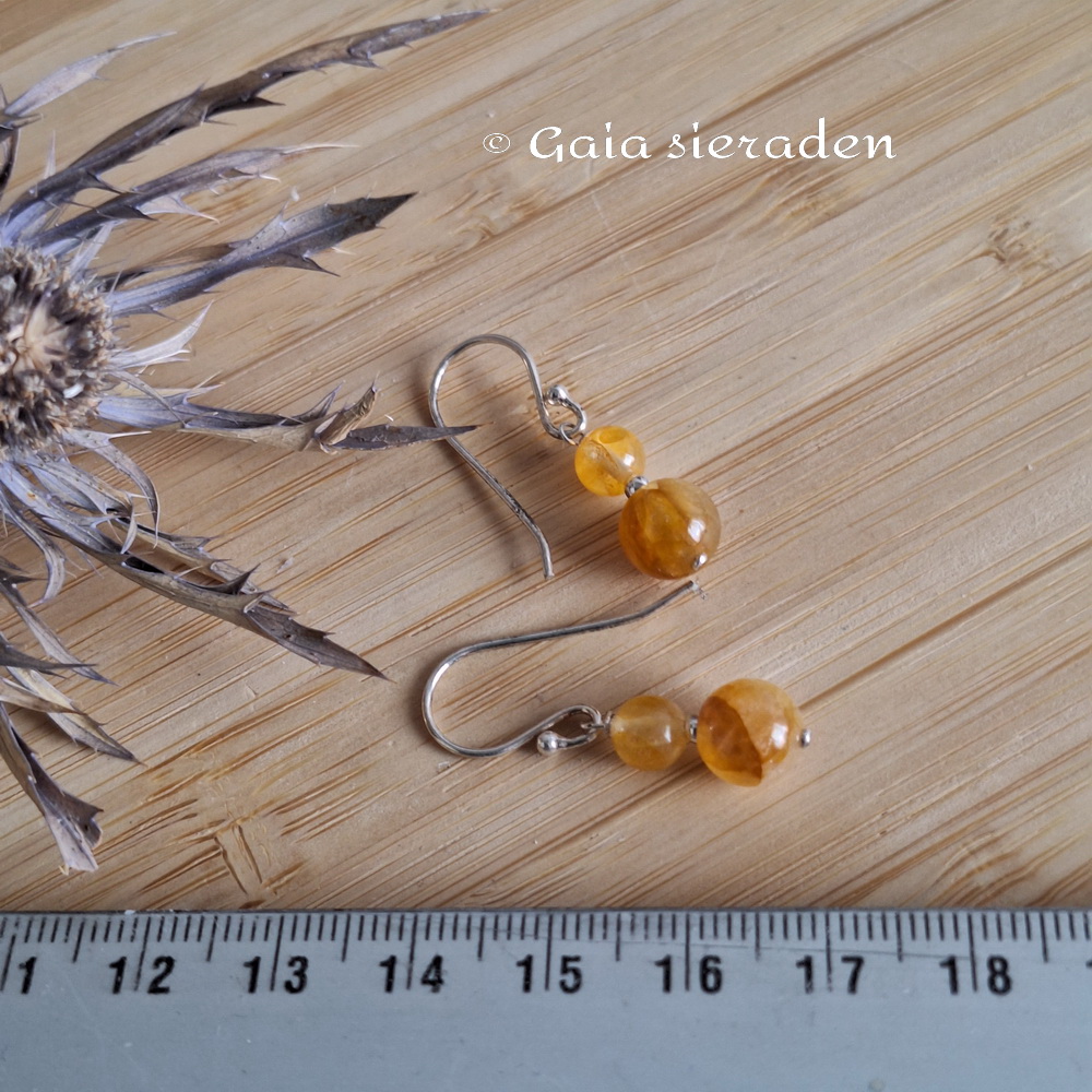 Golden healer oorbellen popje